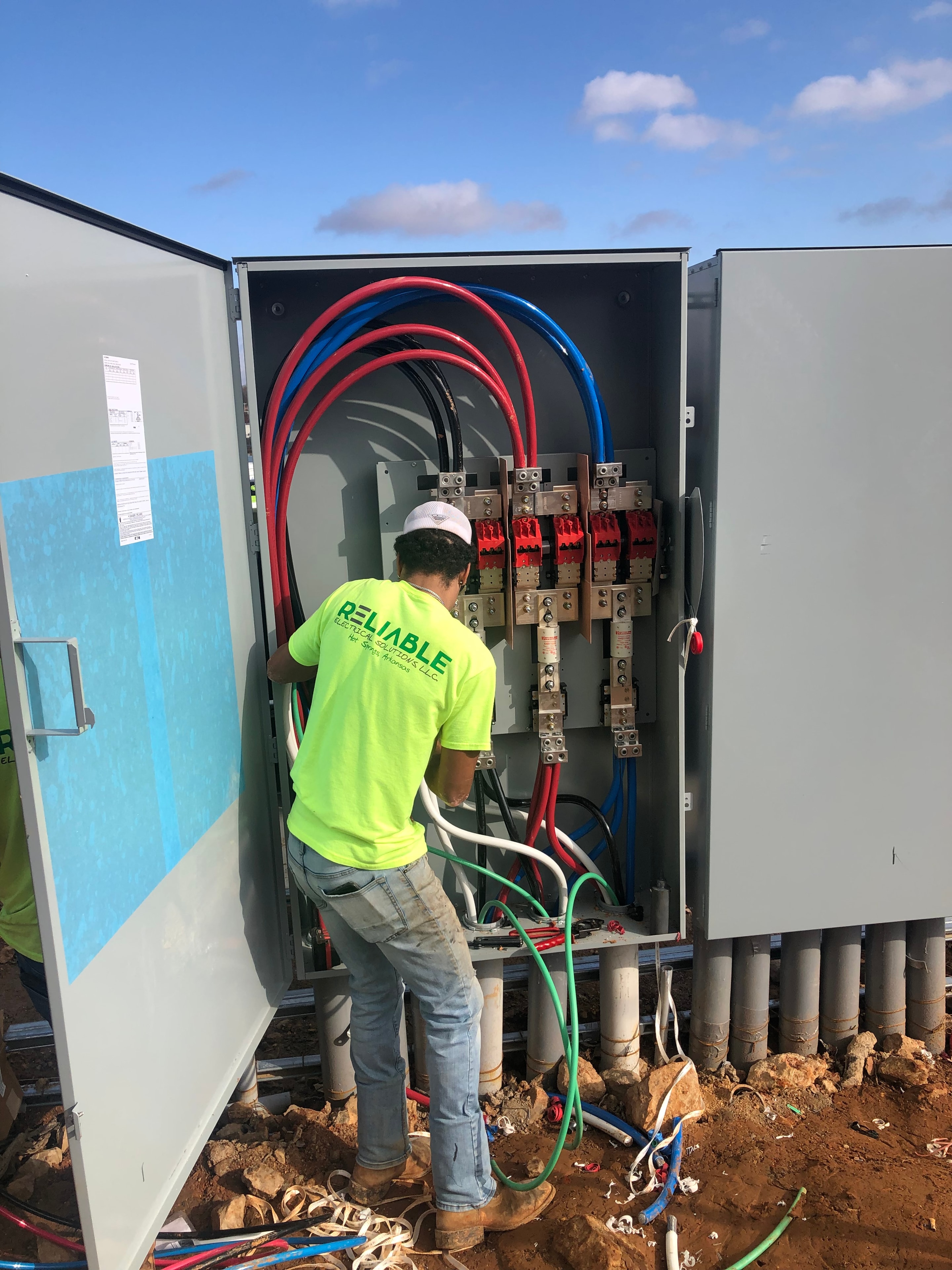 Reliable Electrical Solutions team member on a commercial job site
